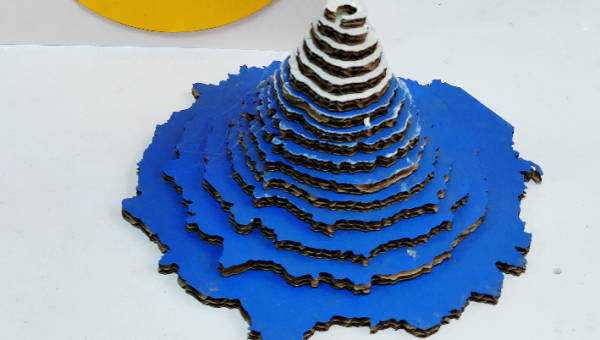 Captivating Nature’s Fury: The Corrugated Paper Volcano Sculpture
